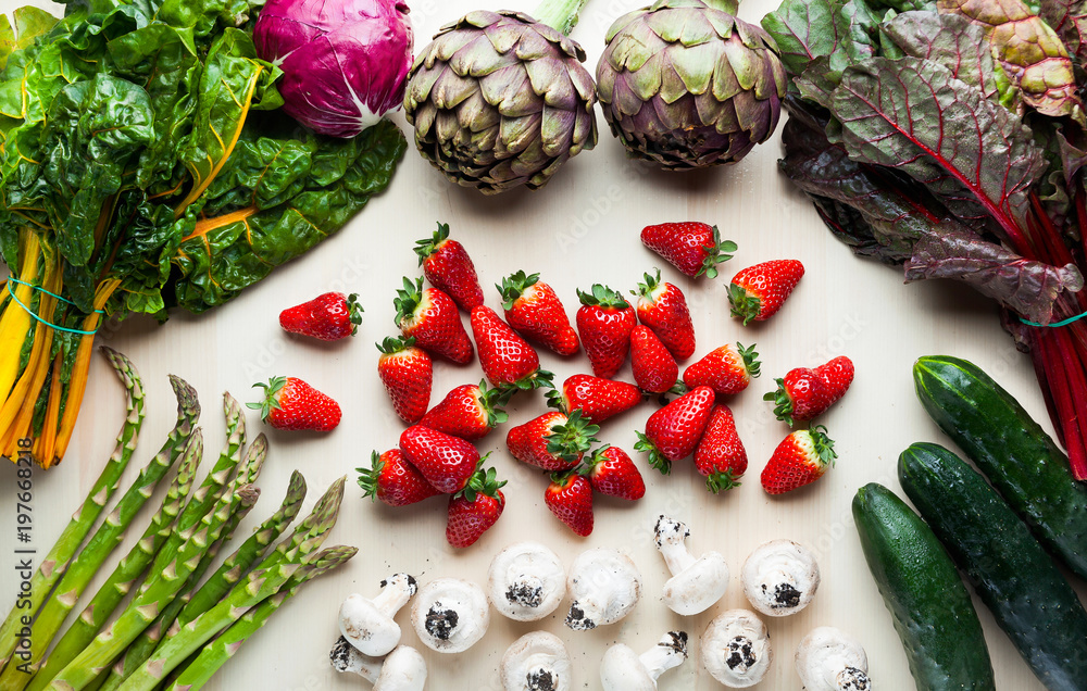 Wall mural food background with italian spring and summer vegetables and fruits. top shot with strawberry