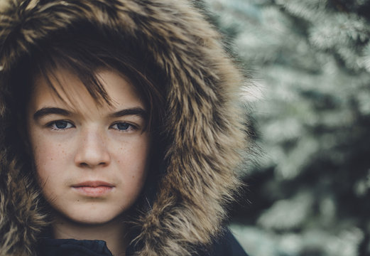 Portrait of teenage girl wearing fur hood