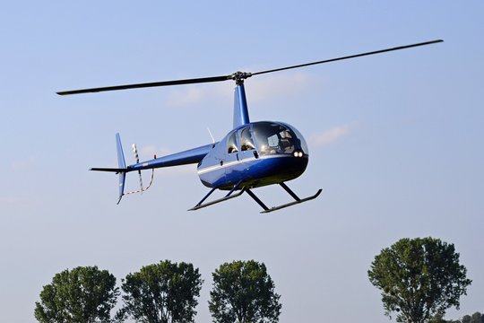 Helicopter flying in the blue sky