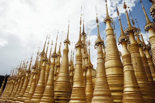 Low angle view of stupas at Shwe Indein Pagoda against sky