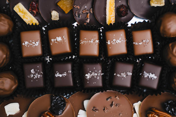 Overhead view of various chocolates at factory