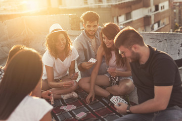 Playing cards on a building rooftop