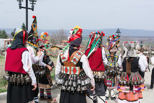 People in traditional carnival masquerade costumes at Kukeri Festival, Medovo village near Burgas, Bulgaria