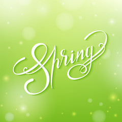 Spring lettering on a blur green