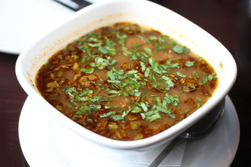 traditional Georgian soup Harcho with greens