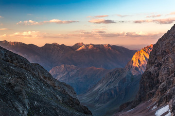 Obraz na płótnie Canvas Colorful mountain peaks on sunset
