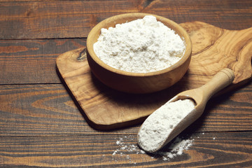 Wheat flour in a wooden bowl