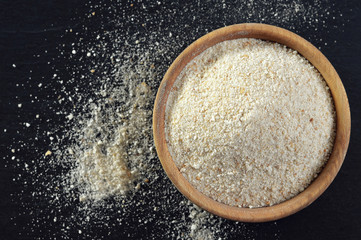 Breadcrumbs in wooden bowl, top view