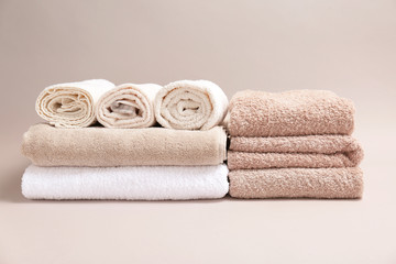Obraz na płótnie Canvas Soft bath towels on grey background