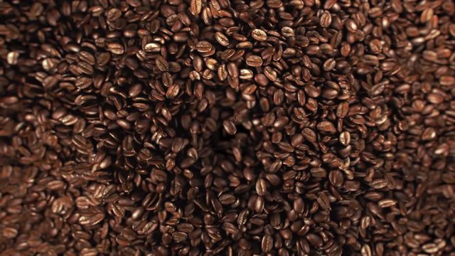 Coffee beans jumping in super slow motion 4K