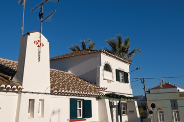 Fototapeta na wymiar Facades of houses in the center of the fishing village of Santa Luzia, Portugal