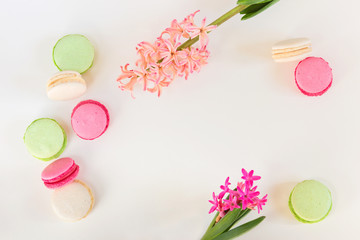 macaroons and hyocinths on a light background