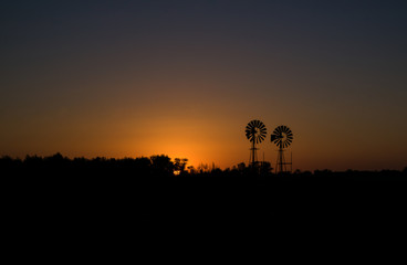 windmills at sunset