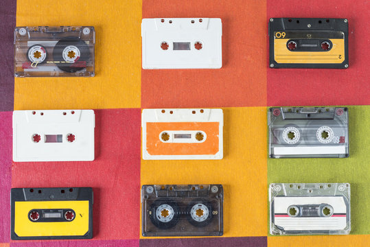 Cassette tapes on a checkered tablecloth