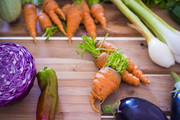 close up of raw carrots and vegetables