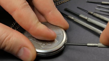 Mechanical watch repair. Watchmaker assembles a watch