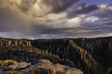 Pinnacles or hoodoos are visible at sunset at Chiricahua National Monument in Arizona, USA.