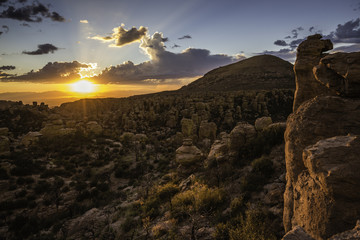 Pinnacles or hoodoos are visible at sunset at Chiricahua National Monument in Arizona, USA.