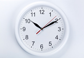 big round clock face on a white table closeup