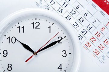 clock face and calendar sheet with numbers