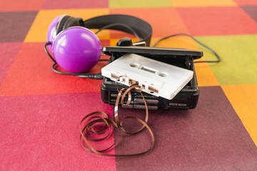 Walkman and headphones on a checkered tablecloth