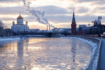 Kremlin and church in winter near river, ice