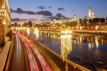 The Moscow Kremlin, a traffic jam, a frozen river, winter