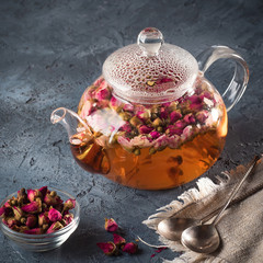 Teapot with detox drink from flower buds dry red pink rose tea w - 197684854