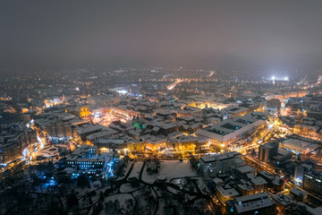 Winter night aerial view from Timisoara taken by a professional drone in the snow. Snow-covered historic center of the city