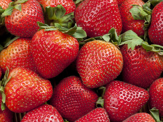 Group of Fresh Stawberries Background with Leaves