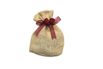 Burlap sack gift package isolated on white background.