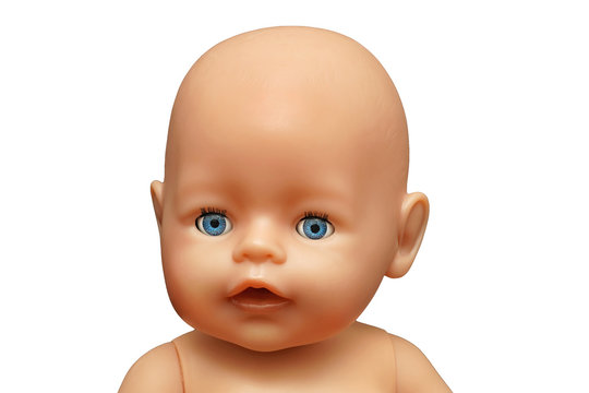 Cute little plastic baby doll with blue eyes