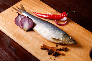 salted herring with red pepper, onion, cinnamon sticks