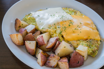 Close up shot of  delicious grill potato, cheese and fry egg