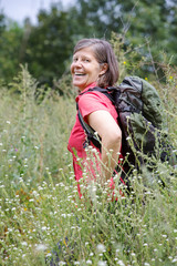 woman in her 50s hiking in nature