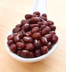 red beans in spoon on table