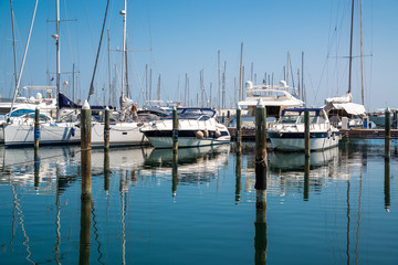 Fototapeta na wymiar White yachts in the port are waiting. Rimini, Italy.