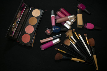 Makeup products on a black background