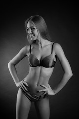 Fototapeta premium young sexy girl in underwear on a black background