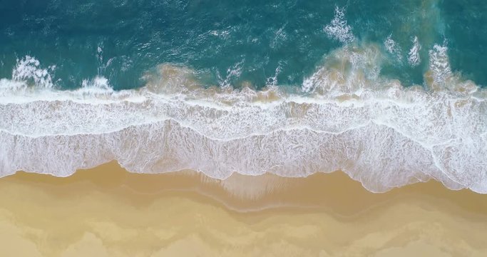 Aerial shot split in thirds by beach surf and deep ocean waves vertical 4K