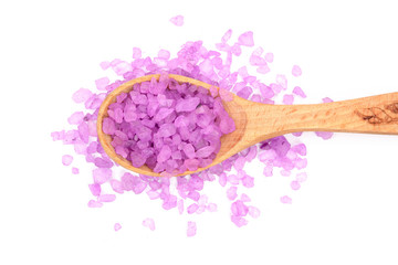 Violet sea salt in wooden spoon isolated on white background, lavender. Top view. Flat lay