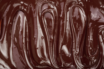 Melted chocolate swirl as a background closeup