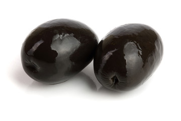whole black olives isolated on white background macro