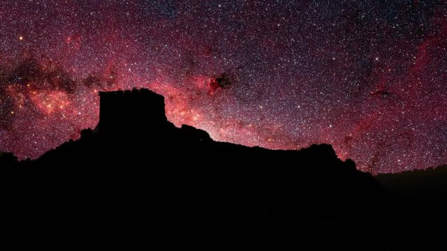 Old world stars. Dramatic time lapse view of stars moving over a old castle ruins.