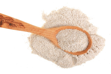 oat flour in wooden spoon isolated on white background. Top view. Flat lay