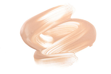 Beige liquid foundation makeup isolated on white background