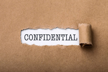 Paper Tear With Word Confidential