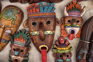 Otavalo, Ecuador- March 17, 2018: indigenous masks made of wood on display in the artisan market