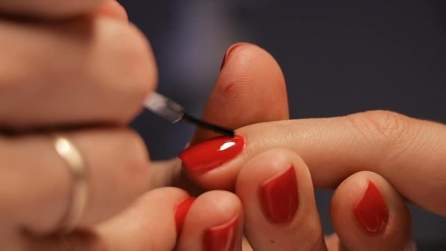 Female hands manicure close up view. red nails