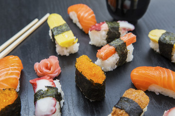 Variety delicious sushi with chopstick